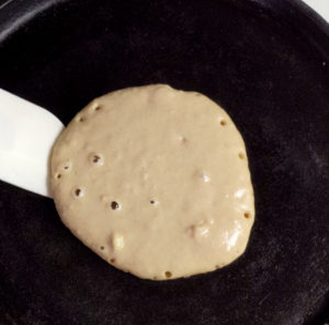 flip pancake when bubbles form on top