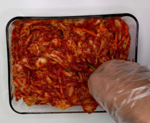 photo showing how to press down on kimchi