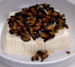 Sauteed mushrooms over steamed silken tofu.